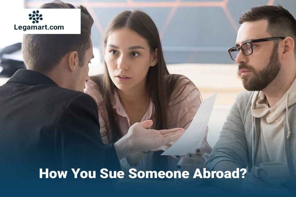 a lawyer explaining to a client the process to sue someone abroad