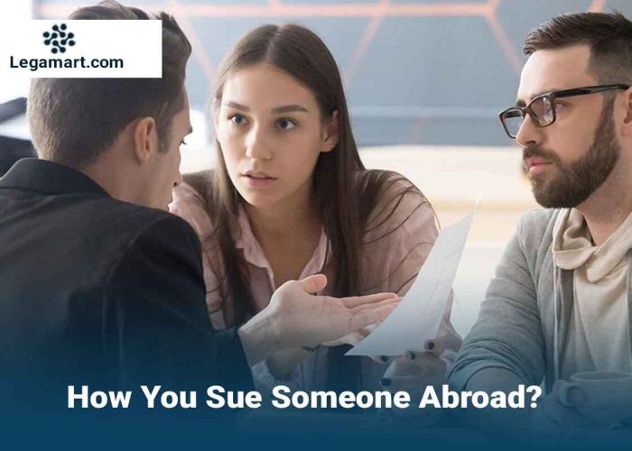 a lawyer explaining to a client the process to sue someone abroad