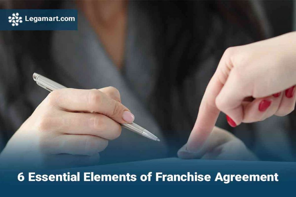A legamart lawyer guiding a client to sign a Franchise Agreement