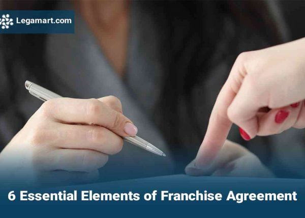 A legamart lawyer guiding a client to sign a Franchise Agreement