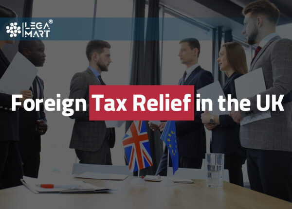 Two lawyers discussing Foreign tax relief in the UK for a business