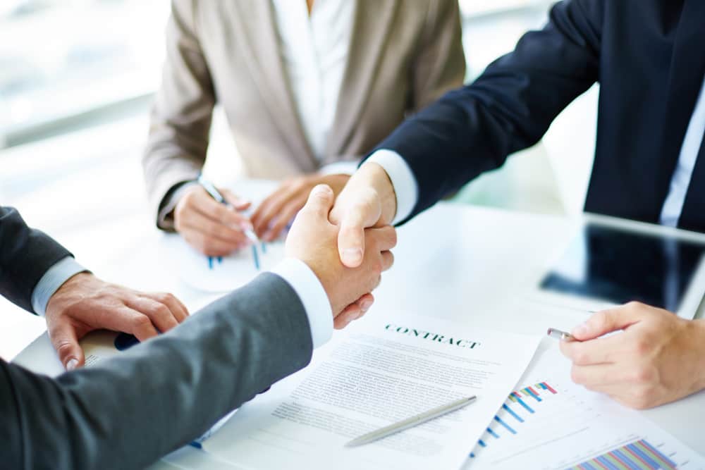 handshake close up executives min - Need for Insurance in Joint Ventures in Commercial and Business Law