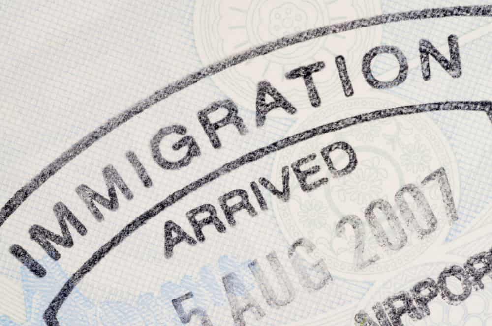 immigration passport stamp min - emigration from Turkey in Immigration Law