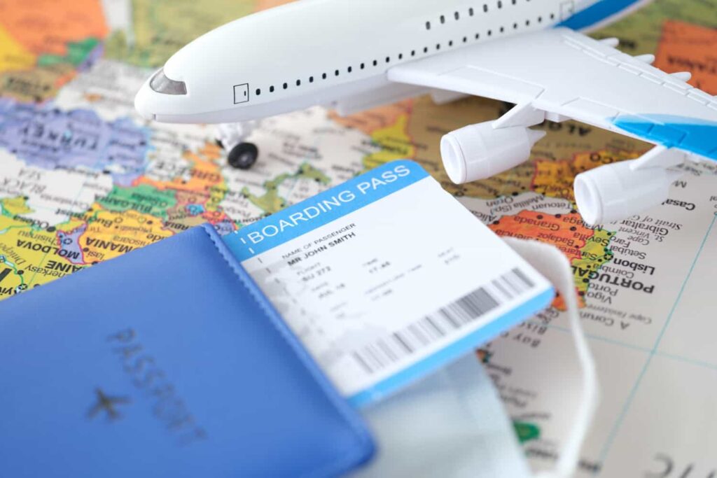 passport plane ticket toy plane stands world map choosing routes travel concept min - Business Immigration from Turkey to Canada in Immigration Law