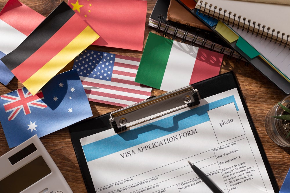 visa application composition with different flags min - working holiday visa for Italian Citizens in Immigration Law