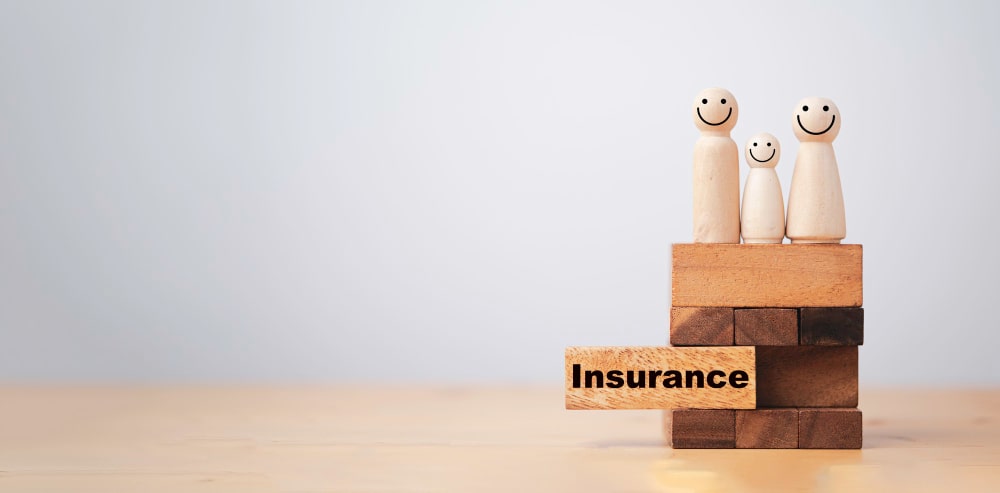 The word insurance written on wooden blocks signfying remote jobs and insurance issues