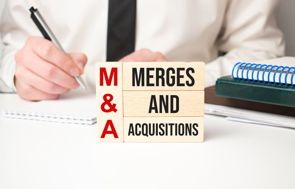 A M&A lawyer researching on mergers and acquisitions 2022 in UK