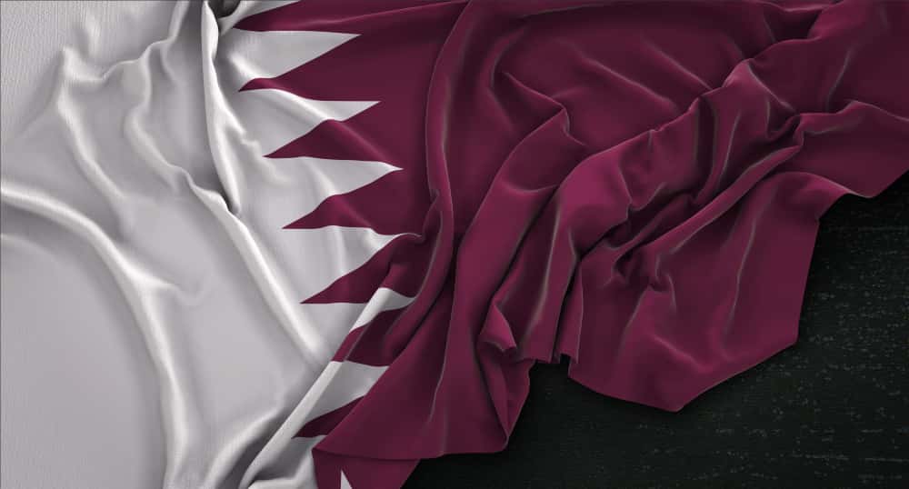Qatar flag in a conference on Gambling Laws in Qatar
