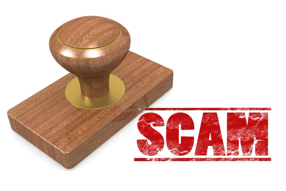 scam wooded seal stamp min - International fraud in Commercial and Business Law