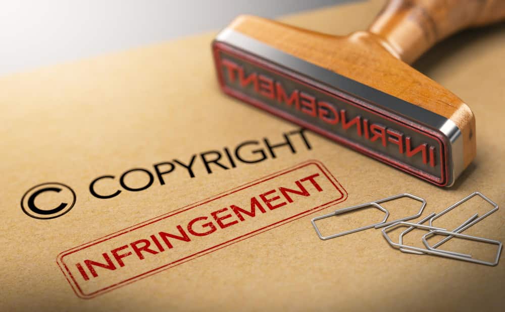 3d illustration rubber stamp with words copyright infringement kraft paper background concept intellectual property 1 min 1 - Innocent Infringement in Intellectual Property Law