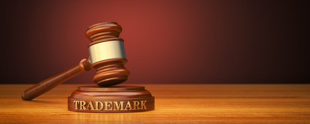 A wooden hammer over a court table trademark protection