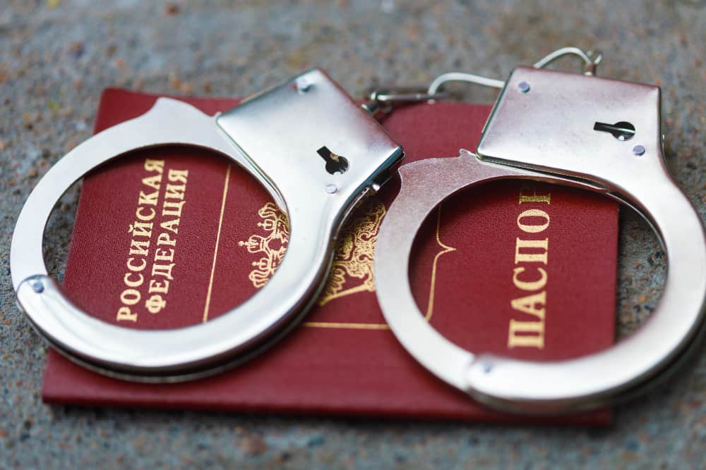 A Passport and handcuffs