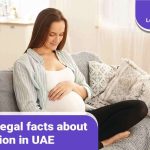 A pregnant woman reading about abortion in UAE