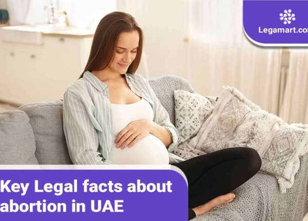 A pregnant woman reading about abortion in UAE