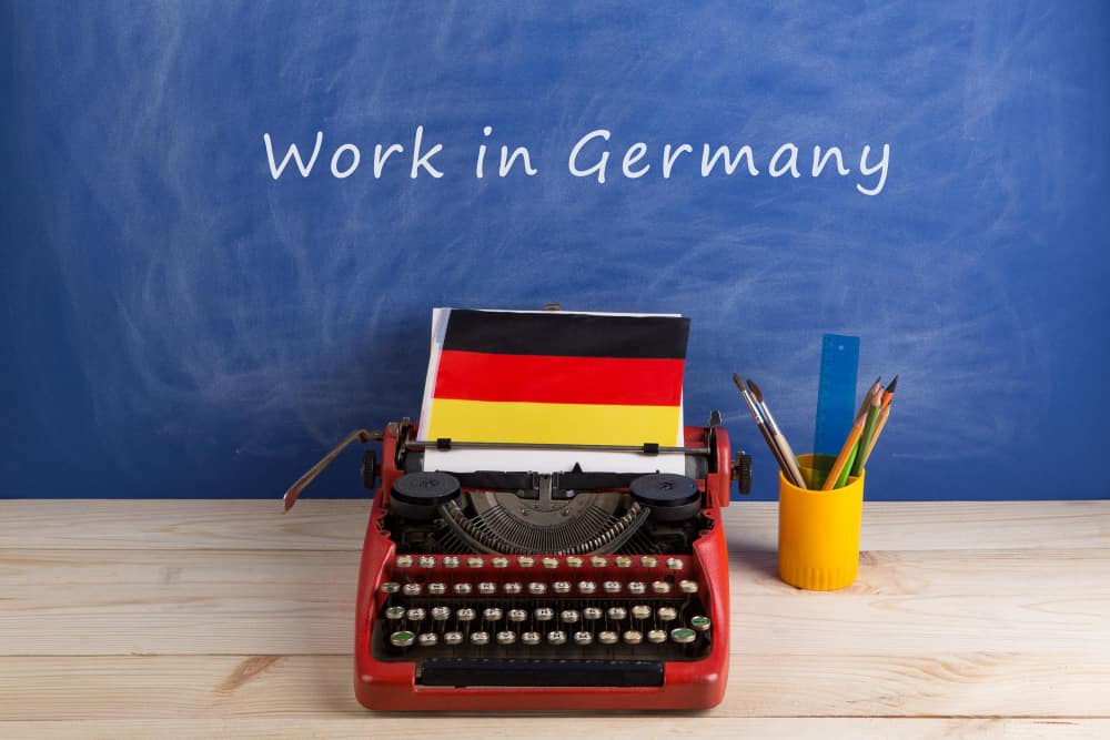 A poster on "work in germany" in a immigration agency