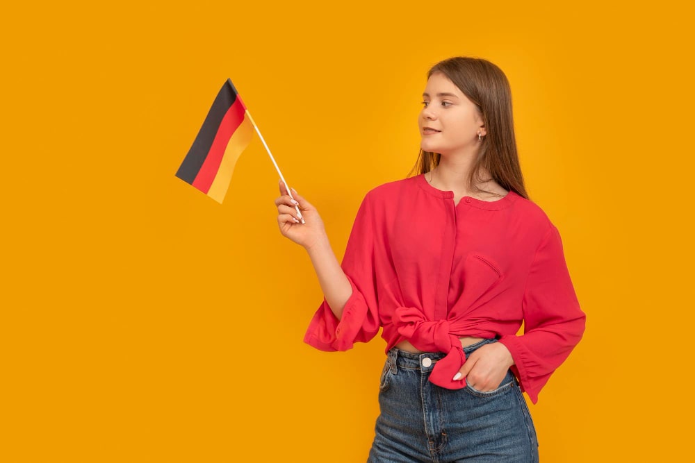 A red top girl holding a german flag 