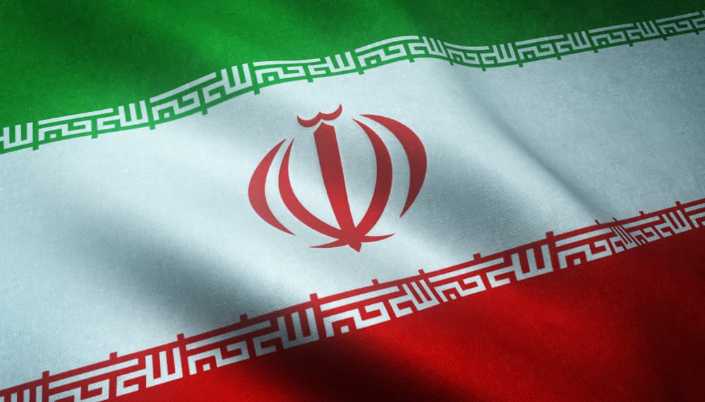 closeup shot waving flag iran min - ofac license in Commercial and Business Law