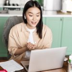 young corporate woman working from home asian girl has online classes remotely talking video chat min - Working Remote Tax Implications in the USA in General
