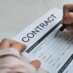 A lawyer reviewing a Contractual Agreement