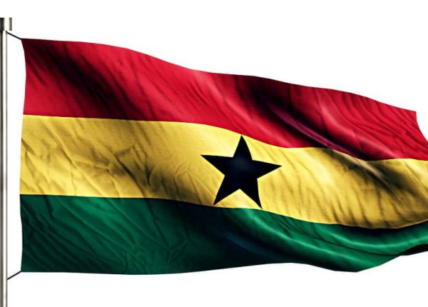 A ghana national flag outside a immigration agency that provides residency and citizenship services