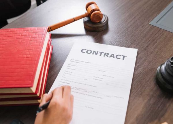 A lawyer reading a contract to handle legal dispute related to Purchase Order contracts