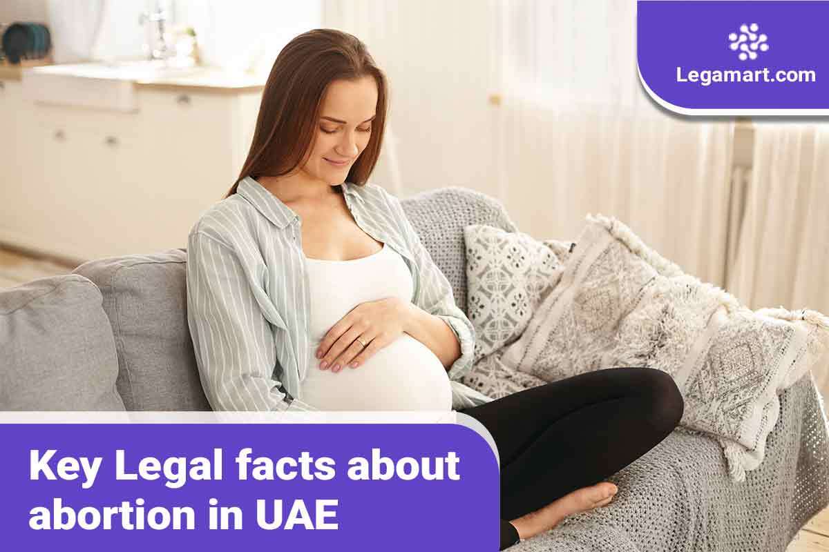 A pregnant woman reading about abortion in UAE